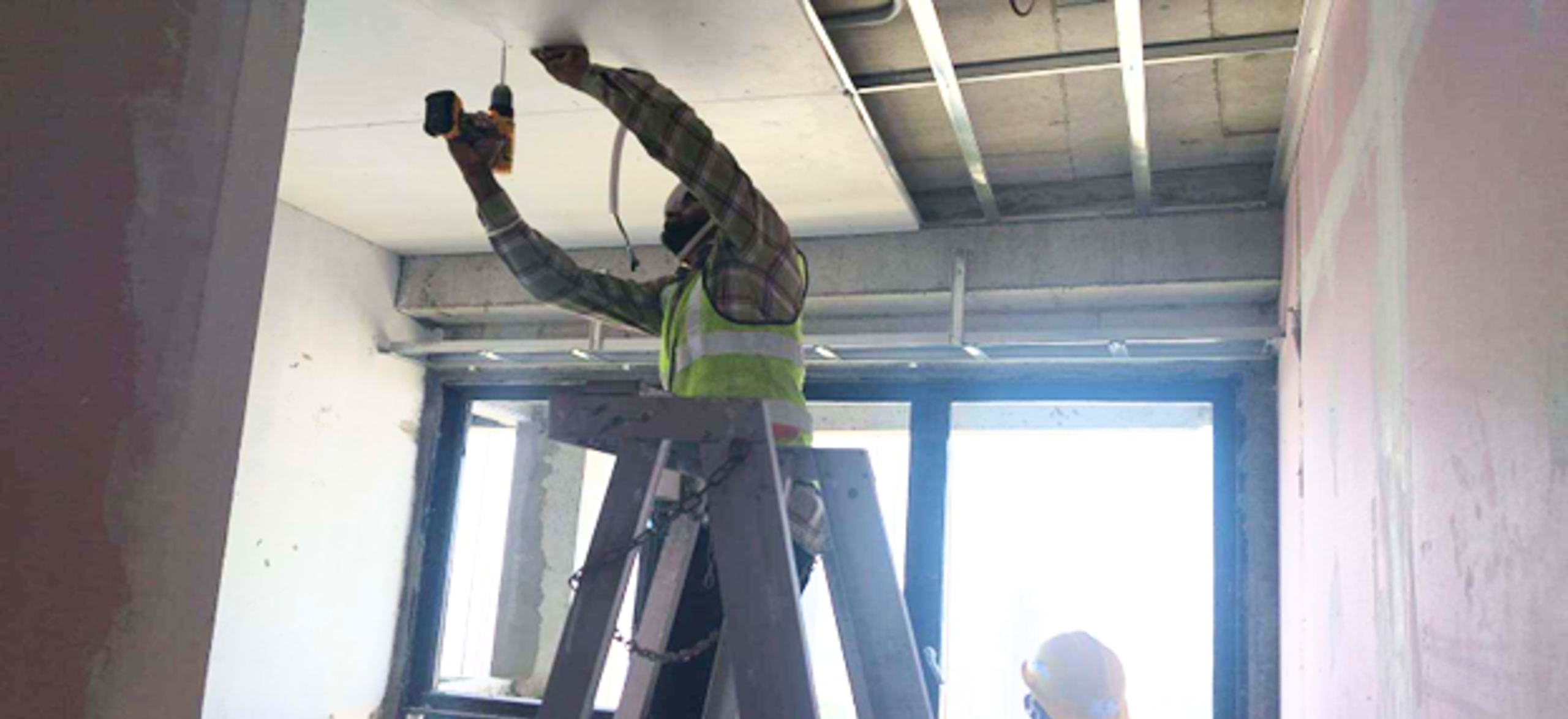 Ceiling installation work in progress at Lentor Hills